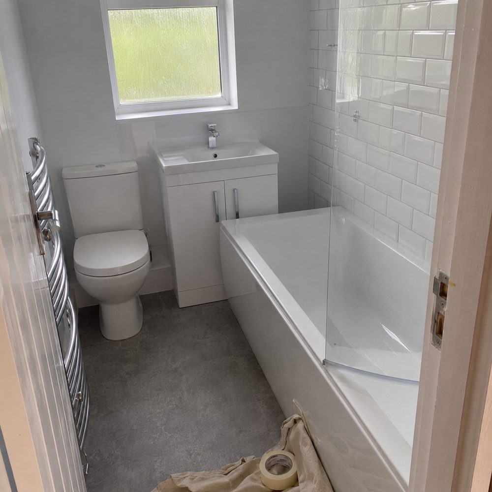 Finished bathroom refit with new bath, shower screen and tiling in Woodley
